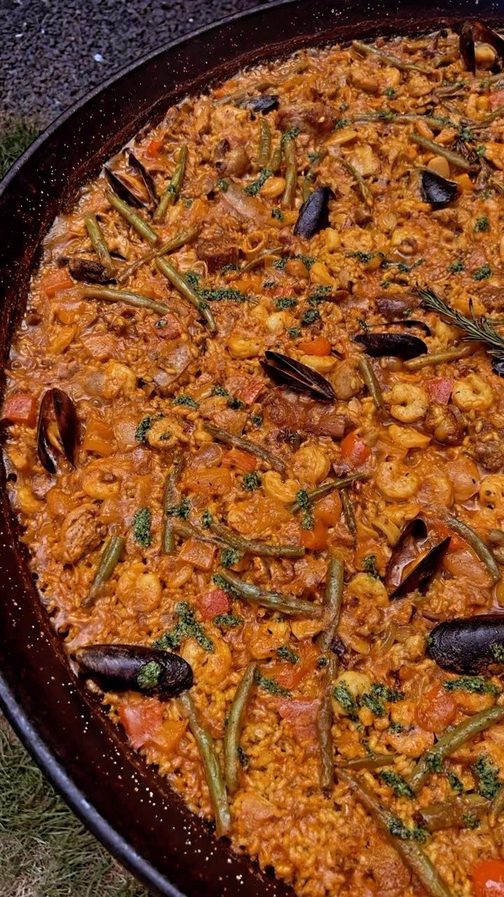 La Mixta aka Mixed Paella with Pork rib Chorizo and Seafood, presented with rosemary garnish
