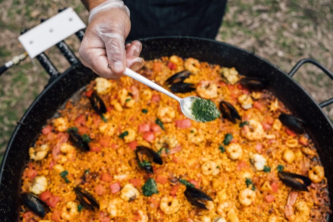 Chef Diego cooking authentic Spanish paella over live fire